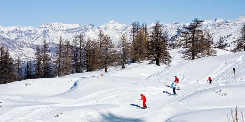 "Skiers in the Europen Alps near Sauze d'Oulx village. Italy, near the France, Europe."
